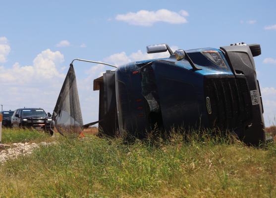 An 18-wheeler hauling rock lost control and rolled over traveling west on Hwy. 25 past Ferguson Road on Wednesday, July 8. No injuries were reported. Photo/Nathan Lawson