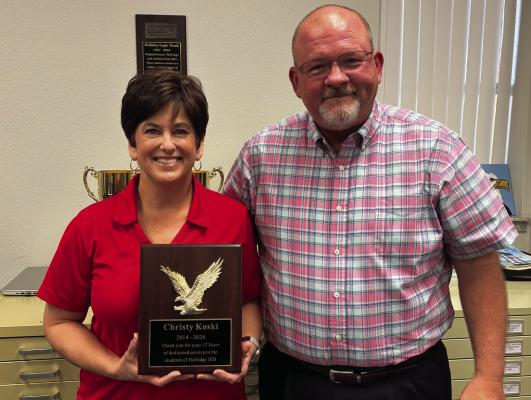 Holliday ISD Superintendent Cody Carroll presented outgoing board president Christy Koski with a plaque recognizing her time on the school board. Photo/Callie Lawson