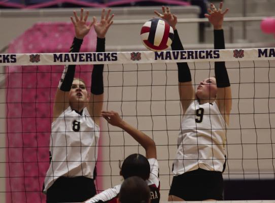 Archer City’s Lyla Nichols and Brilee Canada go for a block in the Lady Cat’s Bi-District sweep over Electra on Thursday, Oct. 30. Photo/Nathan Lawson