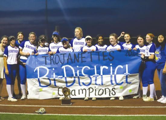 The Windthorst Trojanettes celebrate with the bi-district championship trophy after rallying to defeat Lindsay, 24-13, on Thursday, April 28. Photo/Will Edwards