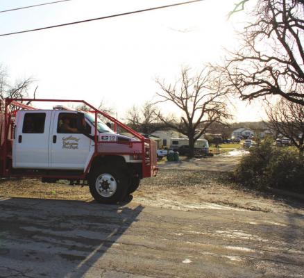 Members of the Scotland VFD assist with search and rescue efforts after a suspected tornado left signficant damage in Jacksboro. Courtesy photo/Mike Williams, Jacksboro Herald-Gazette