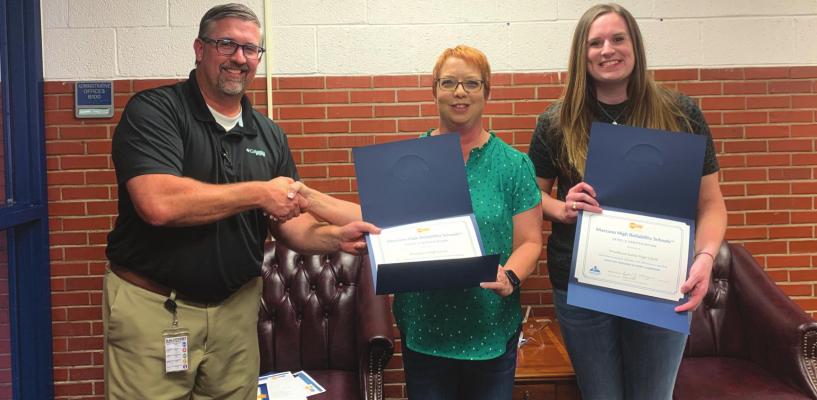 Superintendent Dr. William Paul presented the certificates for the Windthorst Junior High and High School Marzano Level II certification to teachers Mealine Beisch and Mackenzie Haverland at the district board meeting Monday, July 11. Courtesy photo/WISD