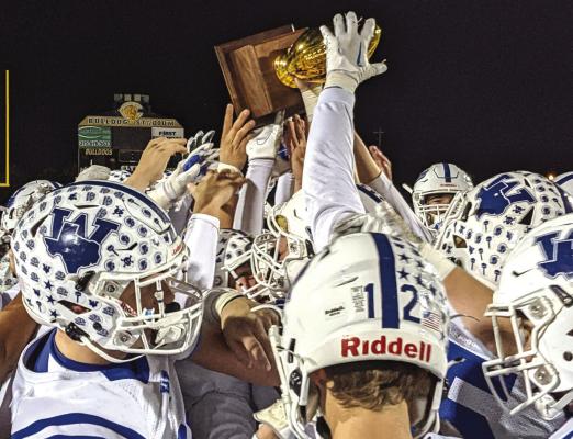 Windthorst players celebrate following an area round 43-29 win over Sterling City on Thursday, Nov. 17, in Clyde. The Trojans meet Collinsville in the regional semifinals on Friday, Nov. 25, in Springtown at 1 p.m.. Courtesy photo/Jonathan Hull
