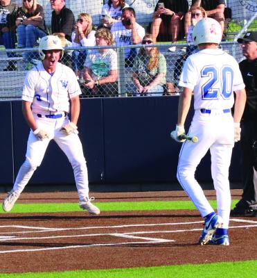 Windthorst Junior Conner Schreiber and Freshman Aiden Stark celebrate at the plate after Schreiber scores the game winning run against Lindsay on May 1. Photo/Nathan Lawson