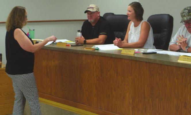 Holliday City Secretary Gerri Ayers swears in new city councilwoman Sharon Long after the votes were canvassed at a city council meeting Monday, May 16. Photo/Nathan Lawson