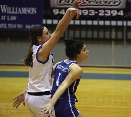 Trojantte Saige Anderson blocks out a Lady Eagle during Windthorst's 72-49 loss to No. 3 4A Decatur on Friday, Dec. 15. Photo/Landon Davis