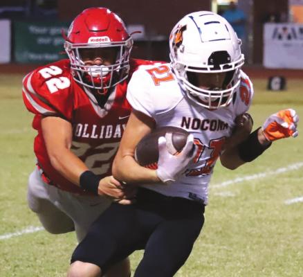Holliday freshman Parker Jones lays out to make a tackle in the first quarter of the Eagles’ 62-14 win over Nocona on Thursday, Oct. 21. Photo /Will Edwards
