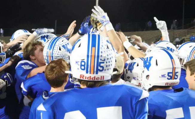 The Windthorst Trojans hoist the State Semifinal championship trophy following their 7-0 win over Wellington on Thursday, Dec. 10, in Vernon