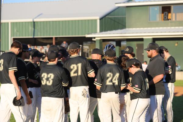Archer City team huddle