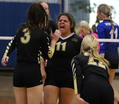 Archer City senior Maddie Lopez celebrates a point in the third set of the Lady Cats' 3-1 win over Windthorst on Saturday, Oct. 16.