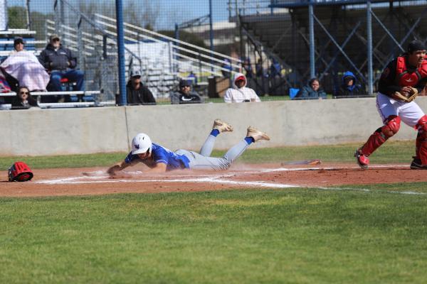 Jaxon Stark slides into home