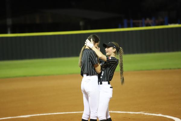Malia Jones and Nicole Crouse embrace