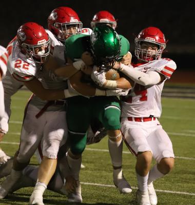 A host of Eagles bring down Iowa Park's Jaydon Southard in the fourth quarter of Holliday's 20-14 win over the Hawks on Friday, Aug. 27. (Photo/Will Edwards)