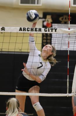 Archer City senior Chandler Clark goes up for a kill in the second set of the Lady Cats' 3-0 win over Petrolia on Tuesday, Oct. 12. (Photo/Will Edwards)