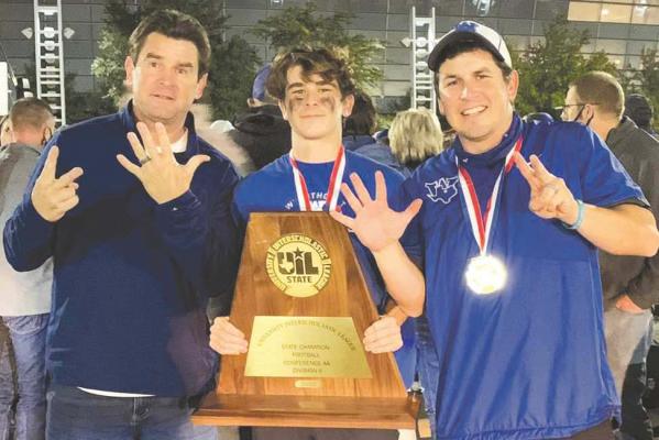 Shannon (left), Max (center) and Tyler Owen (right) celebrate following the Trojans’ 22-21 victory over Mart in AT&T Stadium on Wednesday, Dec. 16. Photo/Shannon Owen
