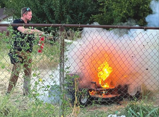 Archer City Police Officer puts out lawnmower fire