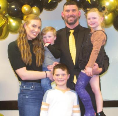 Bradan Ritchie (middle) poses for a photo with his wife, Kayla, and children Knox, Campbell and Whit after being named the ACISD athletic director and football coach. Photo/Nathan Lawson