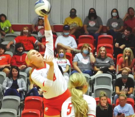 Sophomore Sydney Linn stretches for a kill in the first set of Holliday’s 3-2 loss at home to Henrietta. Photo/Will Edwards