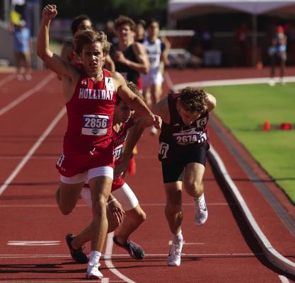 Holliday Noah Strohman raises his arm as he crosses the finish line in the 800-meter to win his 10 career state track gold medal at the 3A Track and Field State Championships on Thursday, May 14. He went on to earn his 11th Individual Medal later that evening in the 1600-meter. Photo/Landon Davis