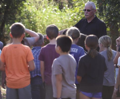 Windthorst fourth graders listen to ACMAC Treasurer Brad Mitchell give a history of Stonewall Jackson Camp and the Comanche Tree Marker on Wednesday, Oct. 1 Photo/Landon Davis