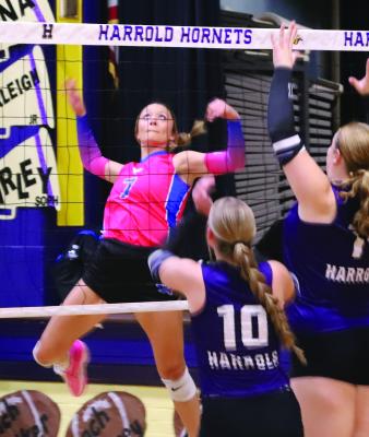 Trojanette Isabel Bussey leaps up for a a kill against Harrold on Tuesday, Sept. 24. Photo/Landon Davis