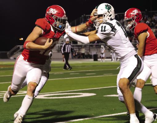 Sophomore running back Brayden Hamill stiff-arms a would-be Blue Ridge tackler in the Eagles’ 42-34 Area playoff round victory on Friday, Nov. 22. File photo