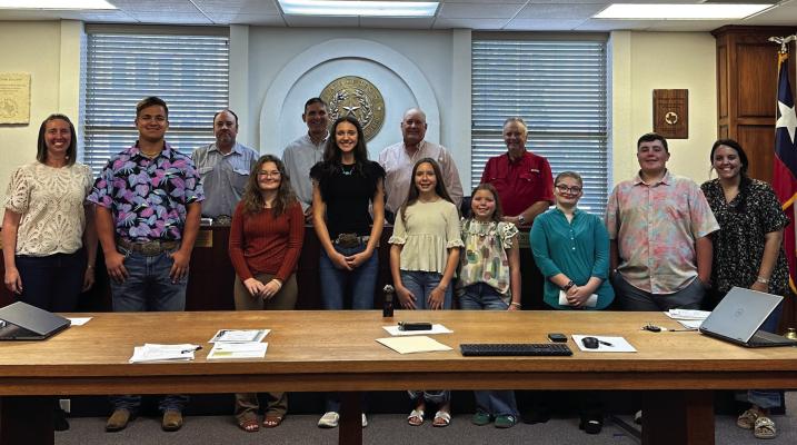 The Archer County Commissioner's Court proclaimed Oct. 6 - 11 as National 4-H Week. Pictured TOP (L-R): Commissisoner Pct. 3 Kendall Coleman, Judge Randy Jackson, Commissioner Pct. 2 Darin Wolf, Commissioner Pct. 1 Wade Scarbrough, BOTTOM (L-R): Extension Agent Maranda Revell, Kreede Neal, Leah Conrad, Gatlynn Revell, Brystol Humpert, Briella Humpert, Taylor Conrad, Brantley Humpert and Extension Agent Kortney Kulhanek. Courtesy photo/PA Vieth