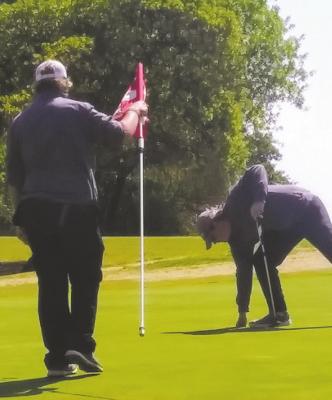 Holliday’s Carson Hall lines up a putt at the Region I-3A Golf Tournament at Shady Oaks Golf Course in Baird. Courtesy photo/Clay Strealy