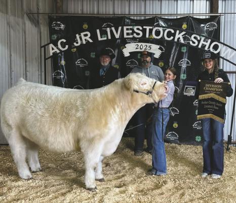 Kinlee Hughes poses with her Grand Champion Market Steer Project. Courtesy photo/ACJLS