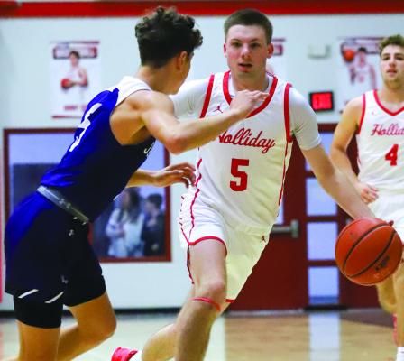 Holliday’s Cayden Howard sizes up a Jacksboro defender in the Eagles’ 57-33 win over the Tigers on Fri., Jan. 5. Photo/Will Edwards