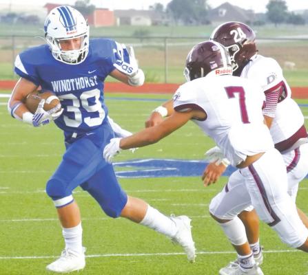 Windthorst senior Ethan Belcher strikes the Heisman pose in the first quarter of the Trojans’ 55-7 homecoming win over DeLeon on Friday, Sept. 4. Photo/Will Edwards