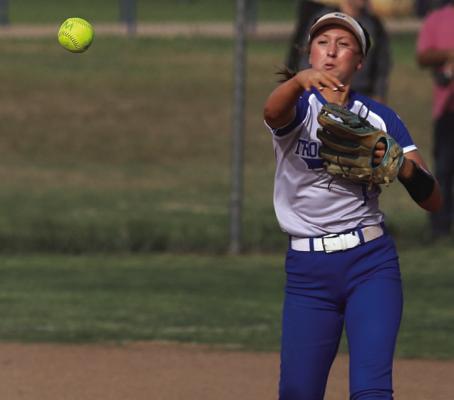 Trojanette shortstop lasers a throw to first baseman Heidi Tackett in Windthorst’ home district battle with Seymour on Tuesday, March 31. Photo/Landon Davis