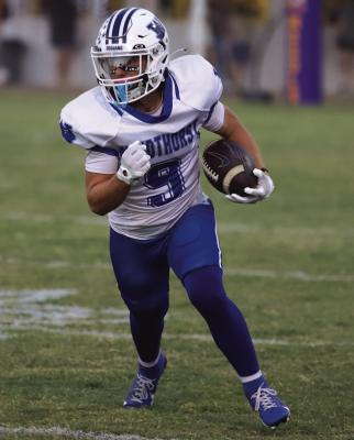 Trojan wideout Ruben Willden looks up field after reeling in a pass in Windthorst’s 76-6 thumping over the Monday Moguls on Friday, Oct. 3. Photo/Landon Davis