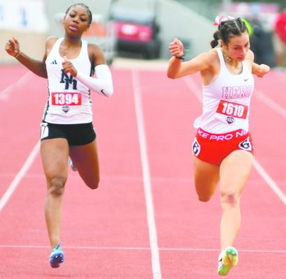 Breagan Blowers crosses the finish line of the 200 meter race with a school record time of 23.98s in UIL 3A State Track meet in Austin. Photo/Micah McCartney, Wise County Messenger