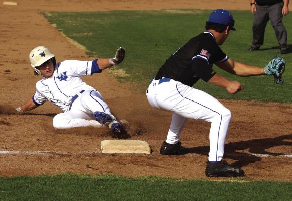 Windthorst’s Cash Armstrong beats the throw to third in the Trojans’ loss to the Gunter Tigers in the Rooster Classic on Friday, March 7. Photo/Landon Davis