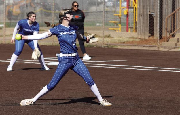Trojanette starting pitcher Jalyn Benson winds up a pitch in Windthorst’s first game in the Iowa Park Softball Invitational. Photo/Landon Davis