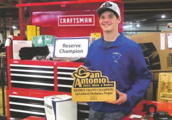 Windthorst ISD Senior Andrew Scheffe poses with his reserve grand champion plaque and prizes from the San Antonio Stock Show and Rodeo.Courtesy photo/Travis Vaughn
