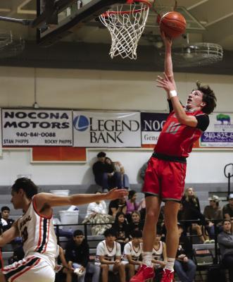 Sophomore guard Jason Luke lays in a bucket following one of his steals against the Nocona Indians on Tuesday, Dec. 17. Photo/Landon Davis