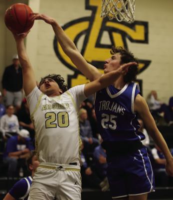 Windthorst’s Avery Schroeder leaps to block Archer City post Maddox Mayo’s layup on Friday, Feb. 6. Photo/Landon Davis