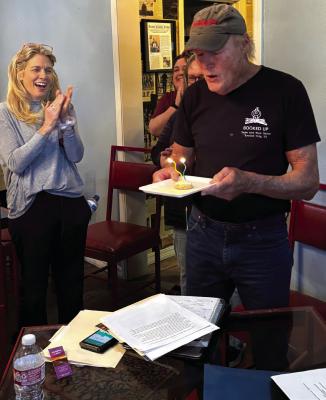 Participants take a break from feedback sessions at the Archer City Writers Workshop (ACWW) to celebrate the birthday of director George Getschow. Ashley Porter, one of the managing directors of the ACWW is pictured at left. Courtesy photo/ACWW