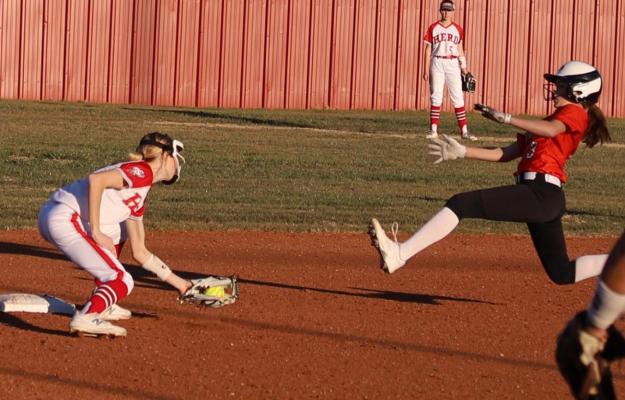 Holliday’s Allie Davis tags out a would-be base stealer in the Lady Eagles’ season-opening 14-0 win over Burkburnett on Monday, Feb. 14. Photo/Nathan Lawson