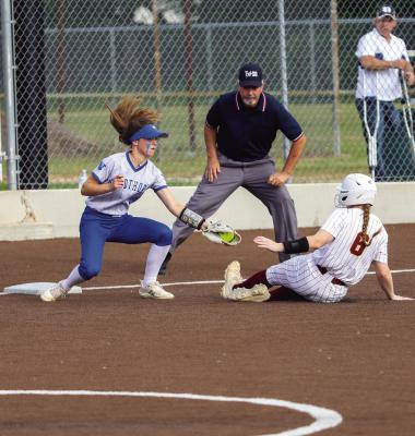 Windthorst’s Bree Kirk tags out a Collinsville baserunner in the Trojanettes’ game one win over the Lady Pirates on Weds., May 10, in Boyd. Photo/Will Edwards