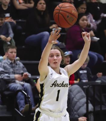 Archer City's Kelsey Aultman bombs home a 3-pointer in the first quarter of the Lady Cats 66-26 loss to topranked Nocona on Friday, Jan. 27 Photo/Will Edwards