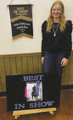 Ella Dora poses with her Best in Show Photography project. Courtesy photo