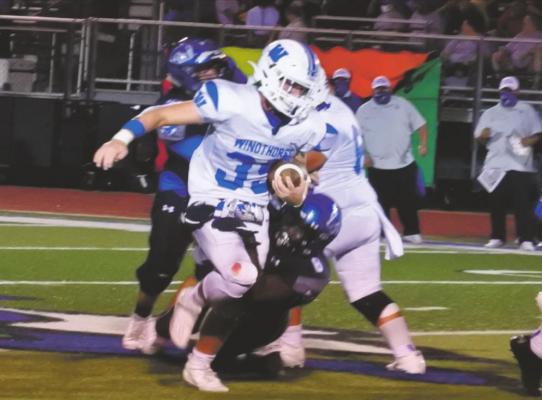 Windthorst senior Ethan Belcher breaks a tackle in the second quarter of the Trojans’ 39-34 win over City View on Friday, Sept. 25. Photos/Will Edwards.