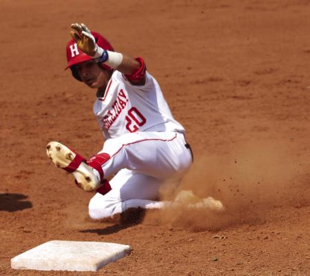 Holliday's Isaac Villa slides into third during a game against the Windthorst Trojans. Photo/Landon Davis