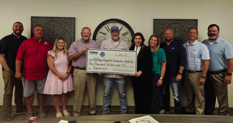 The Holliday Education Foundation received a $1,000 donation from Atmos Energy. Pictured left to right: Holliday Education Foundation Board Members Peyton Cannedy, Matthew Lang, Mackenzie Stubblefield, Cody Carroll, Hayden Hansen, Pam Hughes Pak (also representing Atmos Energy), Jenny Stevens, Dennie Atchley, Hank Bullinger, and Chad Hughes. Courtesy photo/Atmos Energy