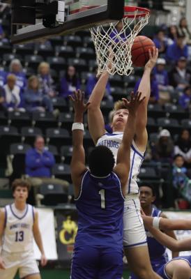 Windthorst post Jaxon Stark fights for a tough bucket in the Trojans’ Bi-District round win over Stamford on Tuesday, Feb. 26 at Breckenridge High School. He finished with a team-high 31 points. Photo/Landon Davis