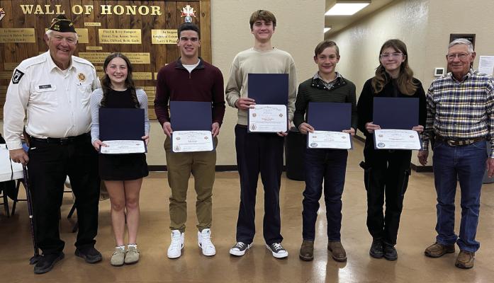 Left to Right: Claude Hoff (VFW Post 2676 Commander), Abigail Young (3d place VOD, Holliday High School), Mark Gorley (2d place VOD, Holliday High School), Matthew Herndon (First place, VOD, Holliday High School), Jude Yates (First place PP, Windthorst Jr. High School), Delaney Barowsky (2d place PP, Holliday MIddle School), John Luig (Post 2676 Auxiliary President) Not pictured: Halli Cure (3d place PP, Holliday Middle School). Courtesy photo