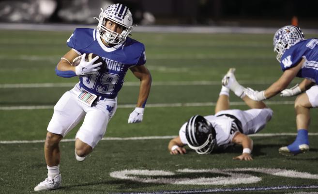 Trojan running back Hunter Anderle cuts around the outside in the Area-round matchup with Lindsay on Friday, Nov. 21. Photo/Landon Davis